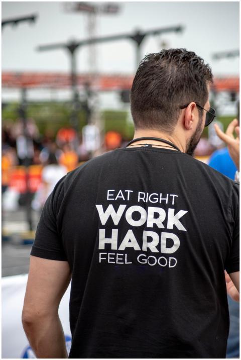 Back view of a man wearing a motivational t-shirt