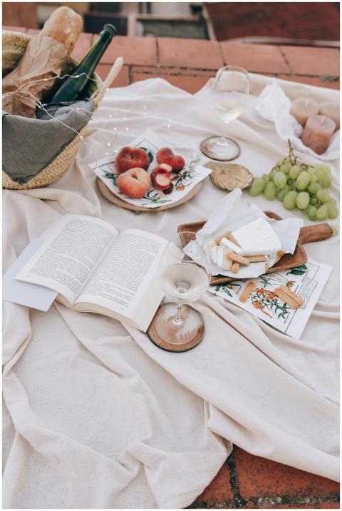Charming picnic spread with fresh fruits, cheese,