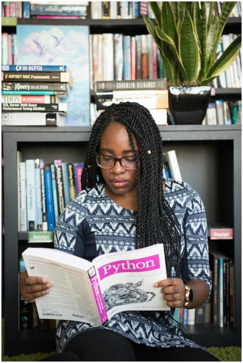African American woman studying Python programming