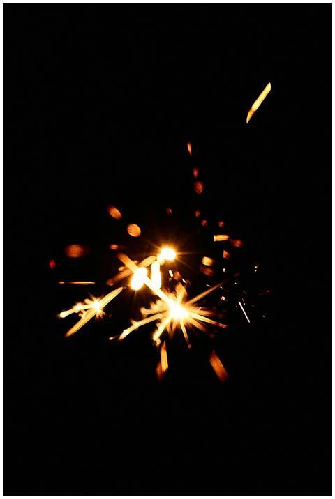 Captivating sparkler light burst against a deep bl