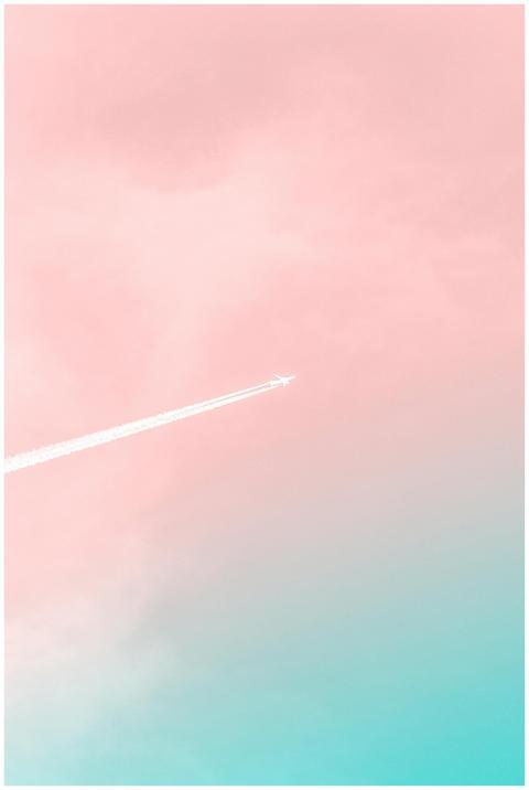 A serene view of an airplane soaring through a pas