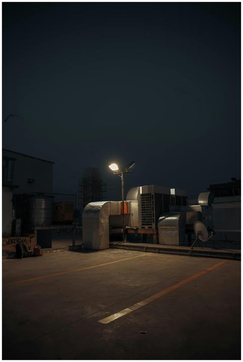 Dark and atmospheric rooftop view with HVAC system