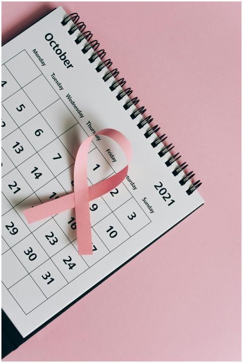 Pink ribbon on a spiral-bound October 2021 calenda