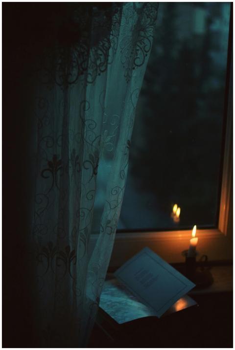 A peaceful scene with candlelight illuminating a b