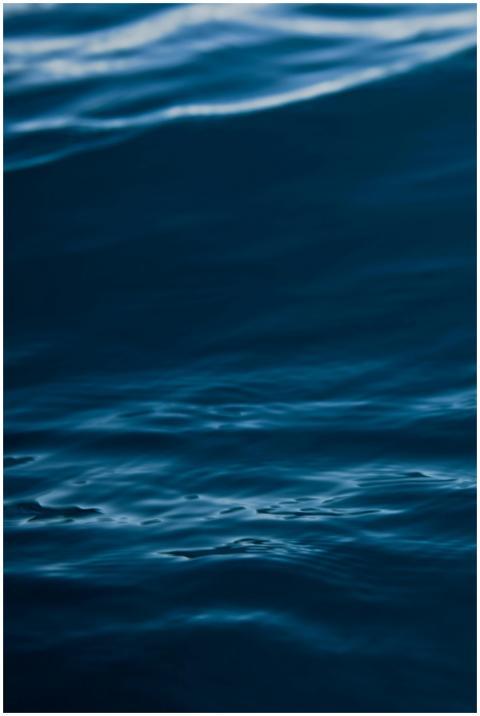 A tranquil view of dark blue ocean waves with gent