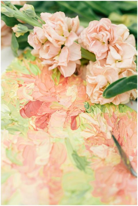 Elegant close-up of pink flowers and a vibrant oil