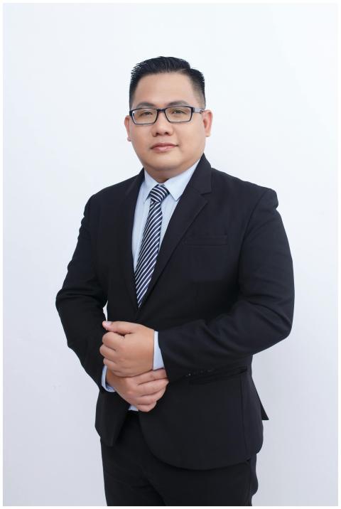 Portrait of a confident businessman in a black sui