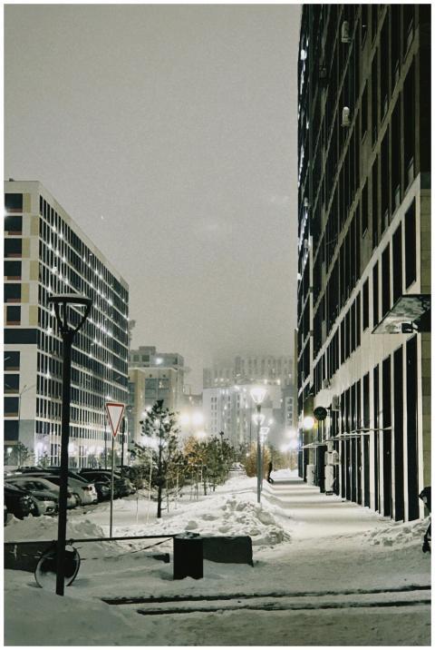 A serene snowy street scene in Astana, Kazakhstan