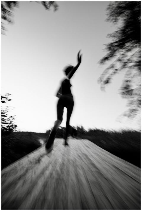 Blurred motion black and white photo of a person r