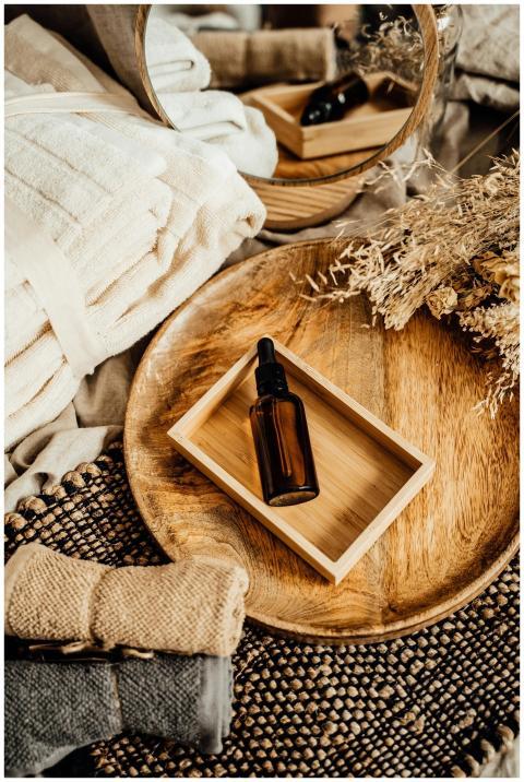 Elegant spa composition featuring glass dropper bo