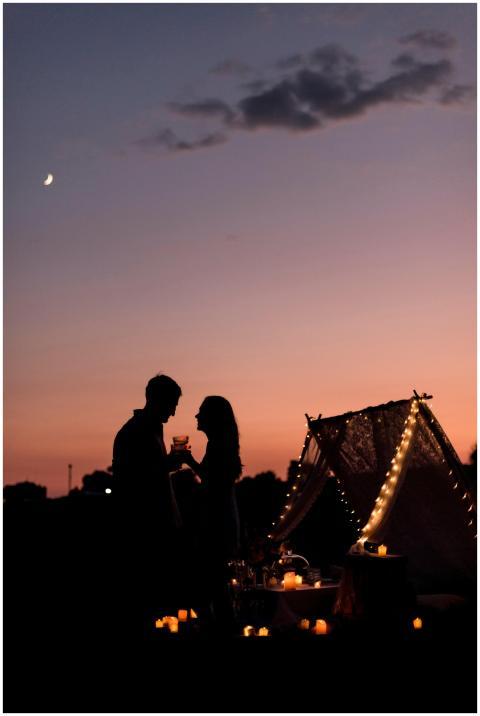 Silhouette of a romantic couple enjoying a candlel