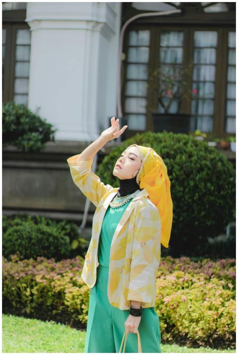 Fashionable woman in colorful attire enjoying a su