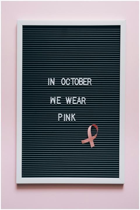 Black letter board with 'In October we wear pink'