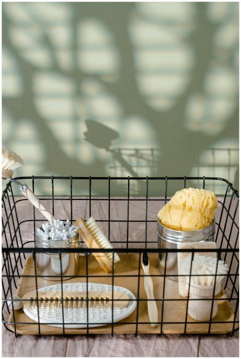 Eco-friendly bathroom essentials in a metal basket