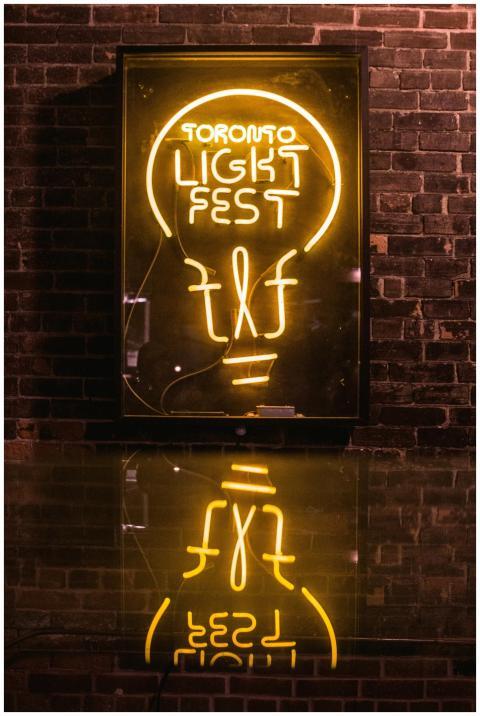 Bright neon sign for Toronto Light Fest against a