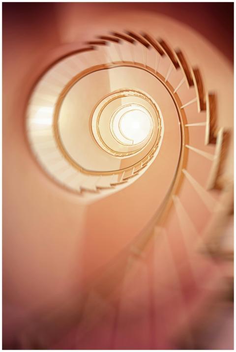 A mesmerizing spiral staircase captured in a soft