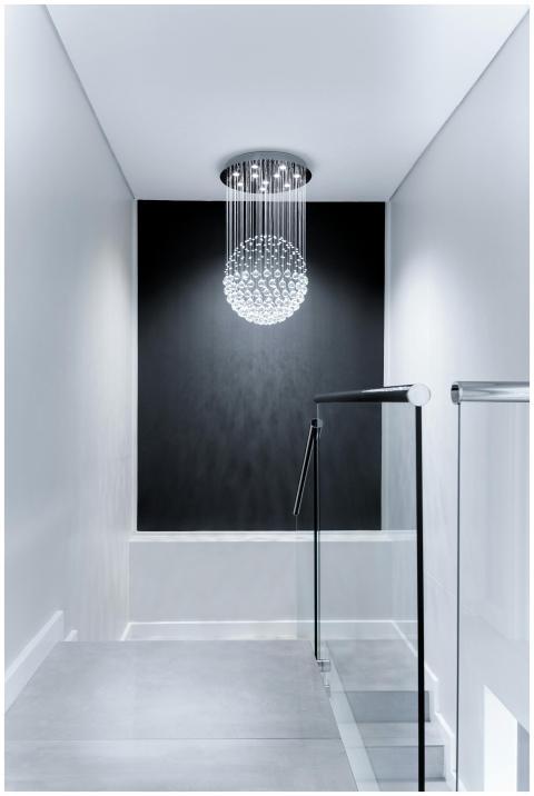 Sleek contemporary hallway featuring a stunning gl