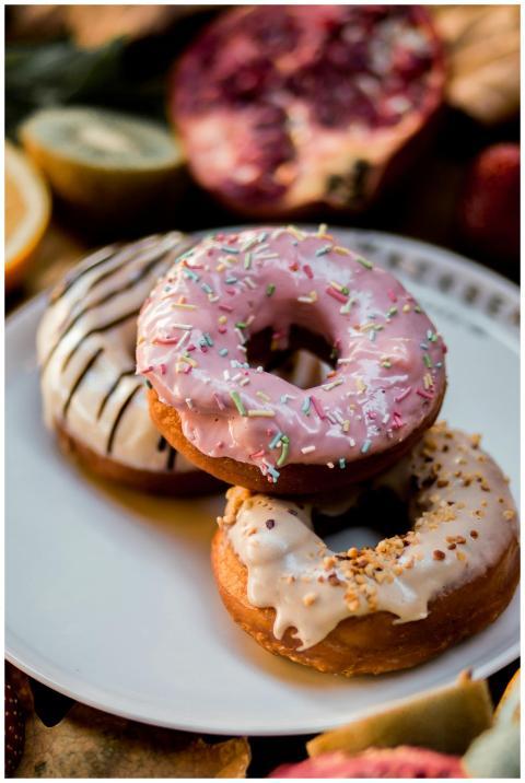A mouthwatering trio of donuts with various toppin