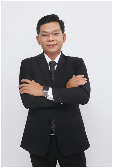 Elegant businessman in a black suit posing confide