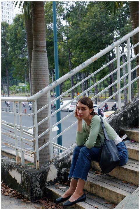 Contemplative Woman Sitting Urban