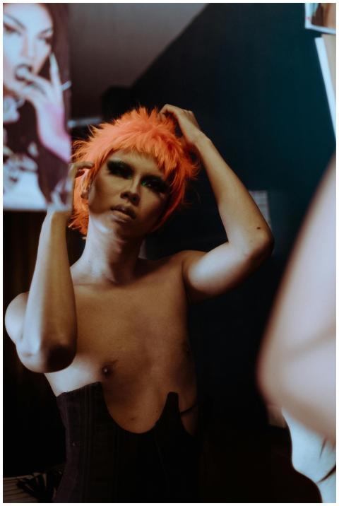 Provocative young ethnic androgynous guy with make