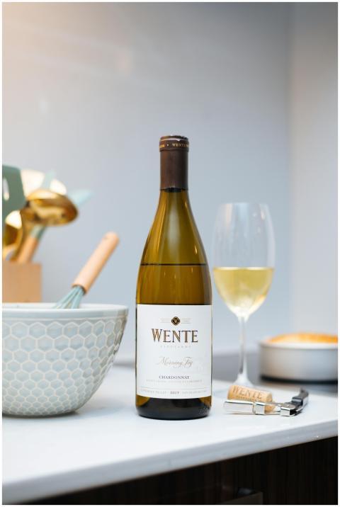 Chardonnay wine bottle with glass in a modern kitc