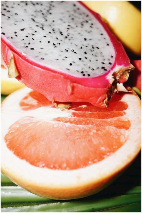 Close-up of fresh dragon fruit and grapefruit slic