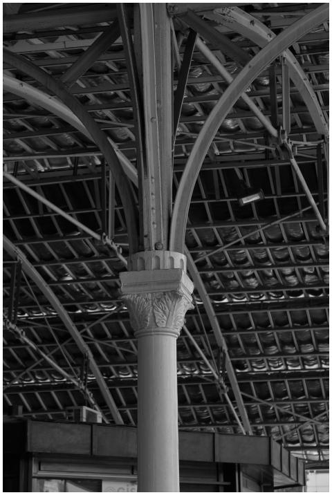 Black and white shot of a vintage ironwork structu
