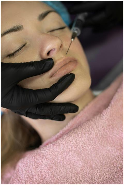 Close-up view of a cosmetic lip injection procedur