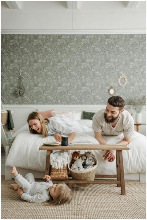 Family bonding time in a cozy bedroom with parents