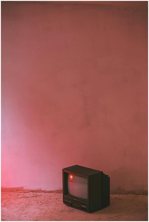 Small retro TV set with plastic case and CRT glass