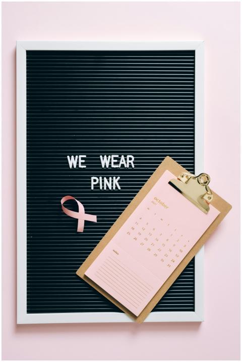 October calendar and pink ribbon on letter board f