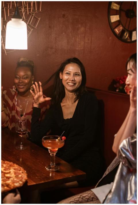 Women enjoying a vibrant night out with drinks and