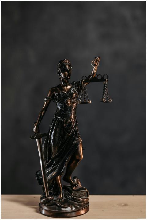 Elegant bronze Lady Justice statuette symbolizing