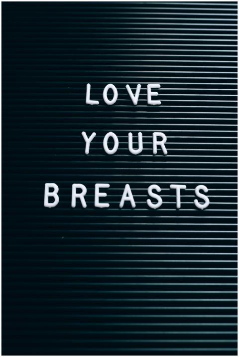 Close-up of text 'Love Your Breasts' promoting bre