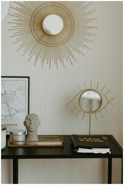 Stylish workspace featuring artistic decor, mirror