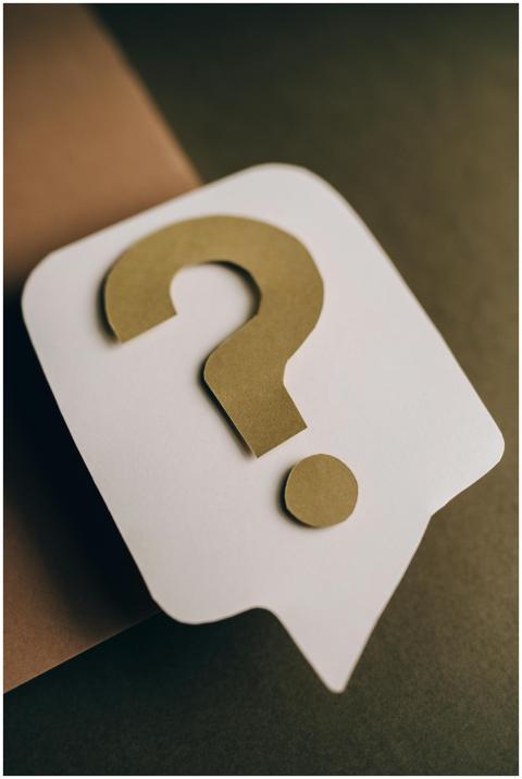 Artistic paper craft of a question mark symbol on