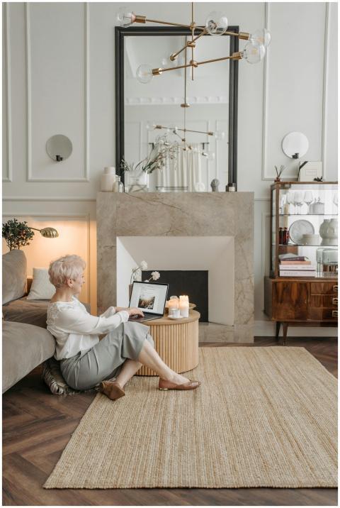 Elderly woman with short hair working remotely on