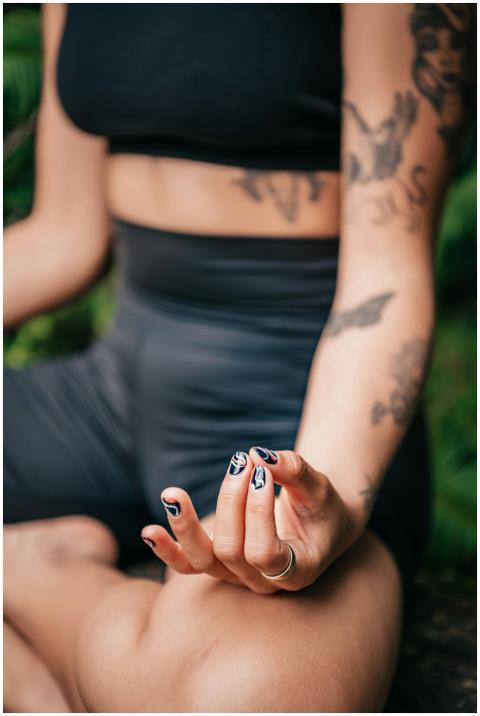 Close-up of a woman meditating outdoors, showcasin
