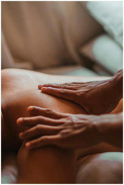 A soothing back massage session in a spa setting,