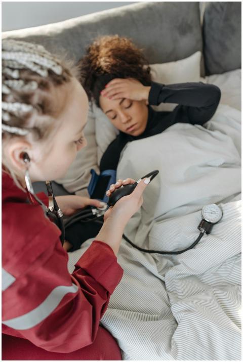 A healthcare professional checking a patient's blo