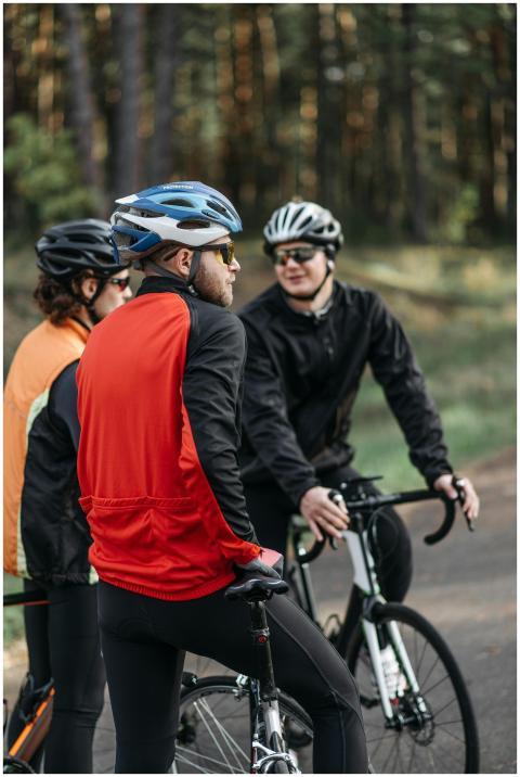 Three cyclists taking a break on a forest path, we
