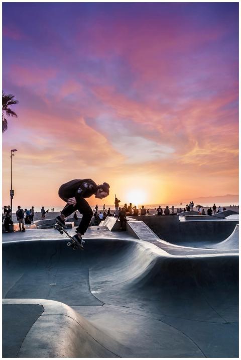 Dynamic shot of a skateboarder in action at Venice