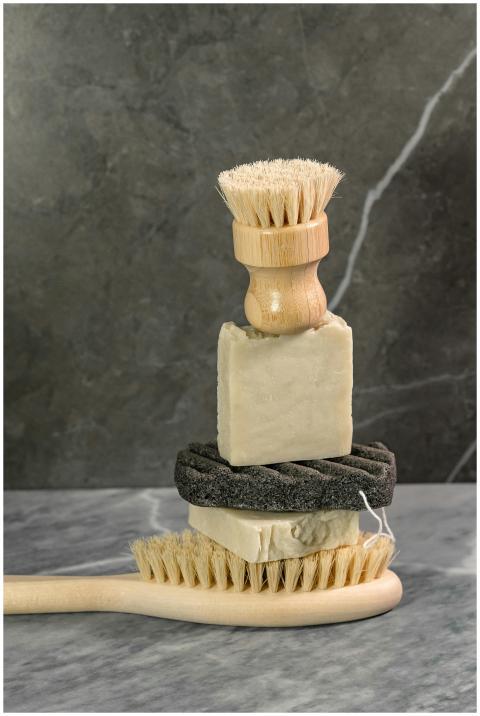 Stacked natural body care items including brushes