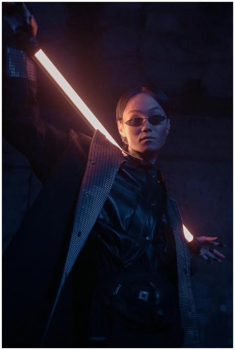 Dramatic portrait of a stylish individual in futur