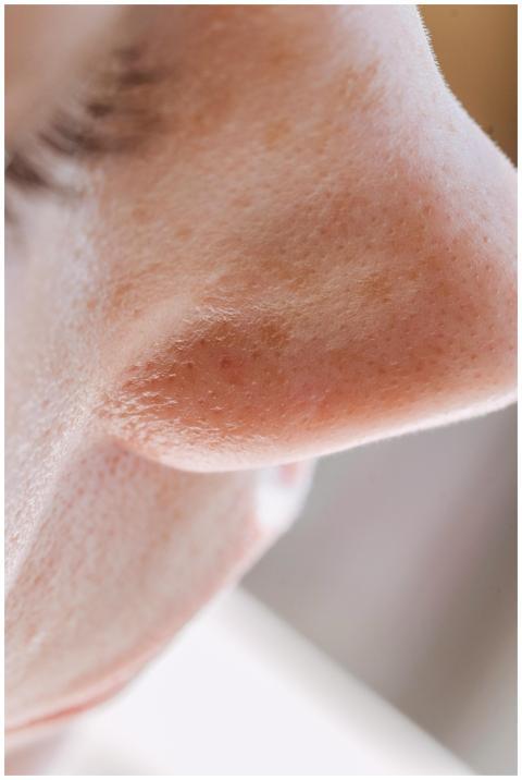 Detailed close-up of a human nose highlighting por