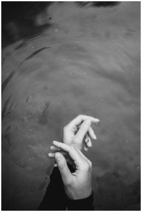 Elegant hands underwater captured in a black and w