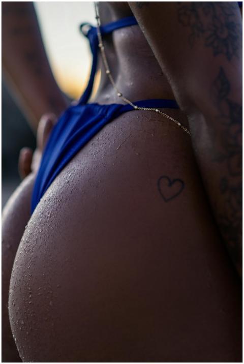 Detailed shot of a woman in a blue bikini with a h