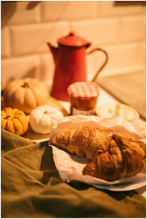 Warm breakfast scene featuring croissants with pum