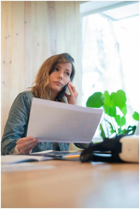 Focused businesswoman reviewing documents in a bri